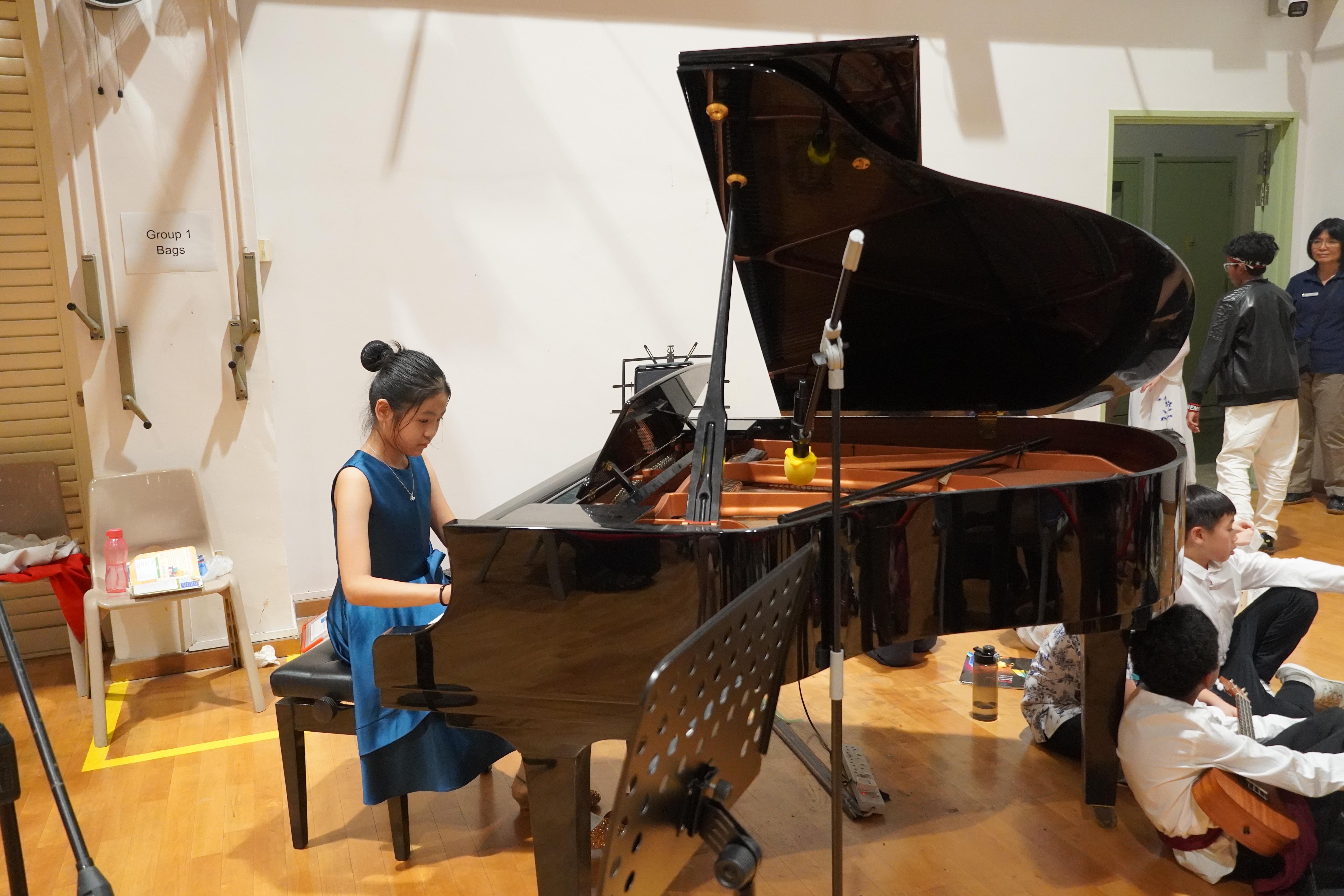 Music at her fingertips! Focused and composed, our student let every note shine on the grand piano.